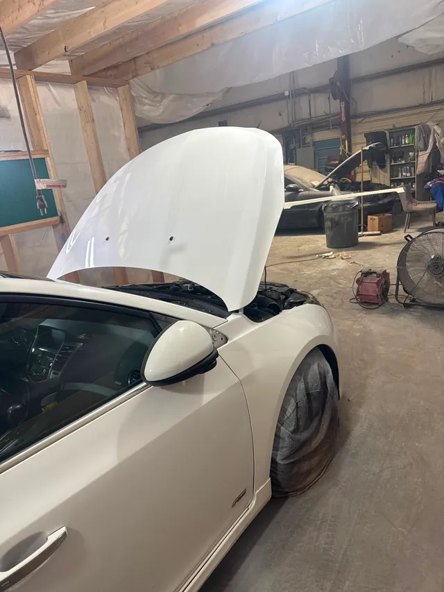 White sedan — painting progress — Stop N Go auto body & paint, Stone Mountain GA