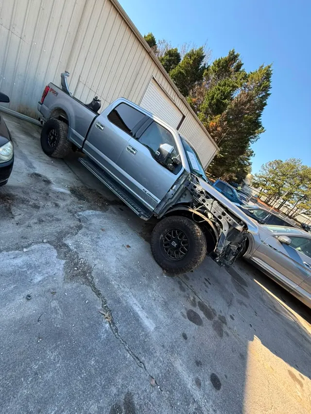 Silver truck — collision before — Stop N Go auto body & paint, Stone Mountain GA